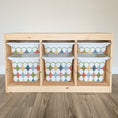 Load image into Gallery viewer, A wooden shelf with six compartments, each containing a colorful plastic storage bin with a diamond pattern design.