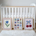 Load image into Gallery viewer, Cherry, tulip and patchwork print set beside a cot