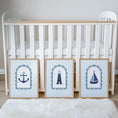 Load image into Gallery viewer, Blue striped coastal print set beside a cot