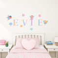 Load image into Gallery viewer, Full display of personalised name fabric wall stickers featuring pastel letters with fairies, stars and toadstools
