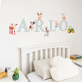 Load image into Gallery viewer, Close view of personalised name fabric wall stickers featuring green gingham letters with farm animals and a tractor