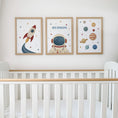 Load image into Gallery viewer, Set of three prints showing rocket, personalised astronaut and planets, above cot display