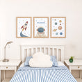 Load image into Gallery viewer, Set of three retro space prints showing rocket, personalised astronaut and planets, bedroom display