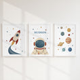 Load image into Gallery viewer, Personalised retro space prints with rocket, astronaut and planets in white frames