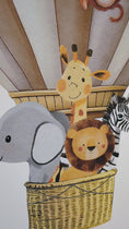 Load and play video in Gallery viewer, a video of wall stickers of safari animals in a hot air balloon surrounded by stars and clouds. The hot air balloon is personalised with the childs name
