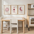 Load image into Gallery viewer, Set of three prints showing rose red sun, moon phases and crescent moon with stars, playroom display