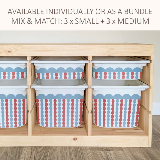 a wooden storage unit with multiple compartments, each containing a plastic bin with a striped pattern in red, white, and blue. The storage unit appears to be designed for organizing and storing various items.