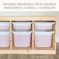 Load image into Gallery viewer, a wooden storage unit with multiple pink plastic bins arranged inside it. The bins are of varying sizes, and the storage unit appears to be made of wood.
