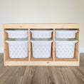 Load image into Gallery viewer, A wooden shelf with six white storage bins arranged in two rows of three, each bin featuring a pink and white patterned design.
