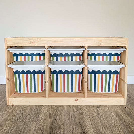 A wooden shelf with six colorful storage bins arranged on it.