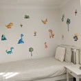 Load image into Gallery viewer, Children's bedroom with dinosaur wall decals on a white wall.
