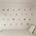 Load image into Gallery viewer, cute animal wall decals above a child's bed
