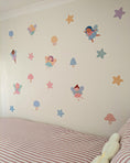 Load image into Gallery viewer, Children's room with fairy and star wall stickers on a white wall.
