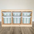 Load image into Gallery viewer, A wooden shelf with six drawers, each containing a white and green patterned storage container.
