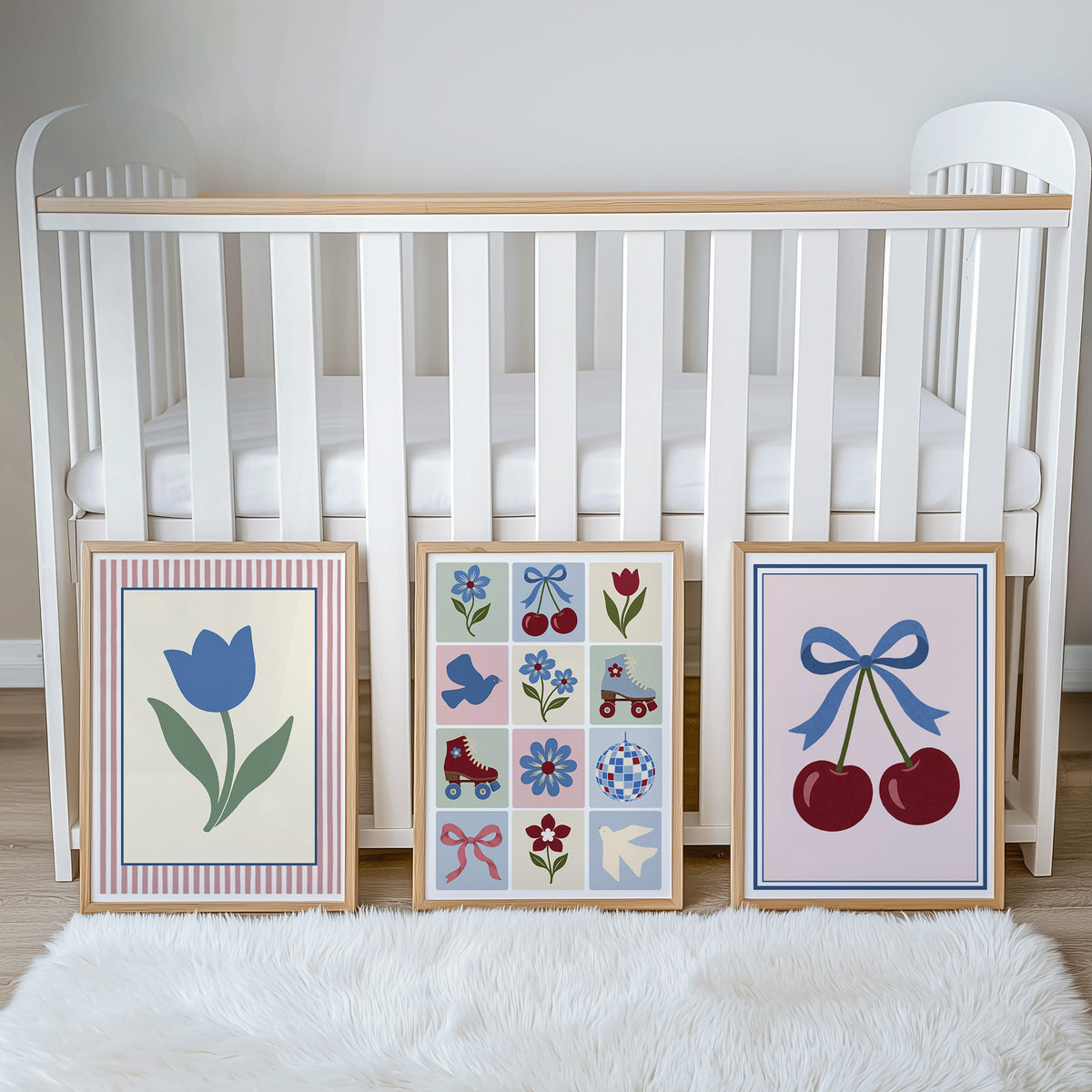 Cherry, tulip and patchwork print set beside a cot