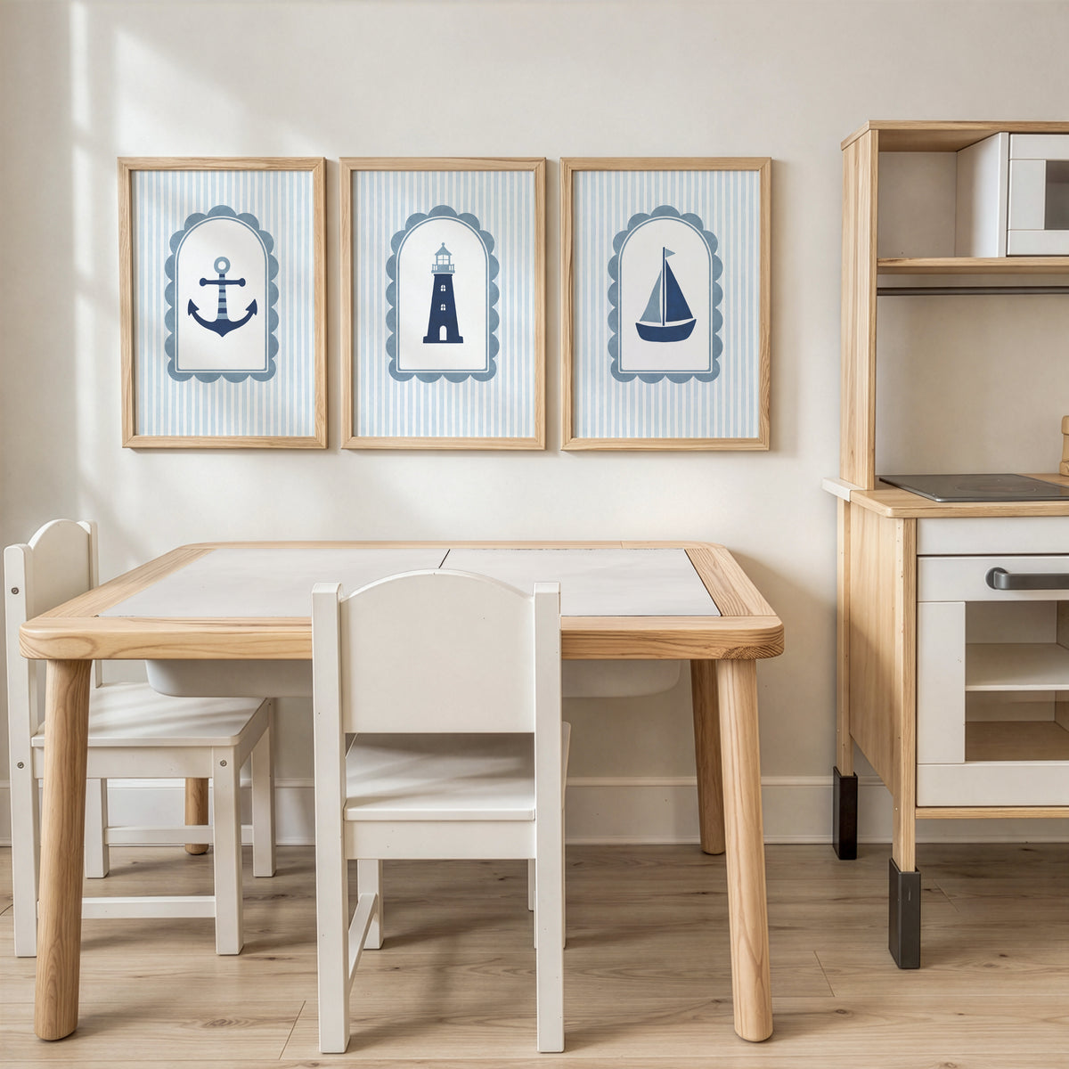 Blue coastal prints above a children's play kitchen