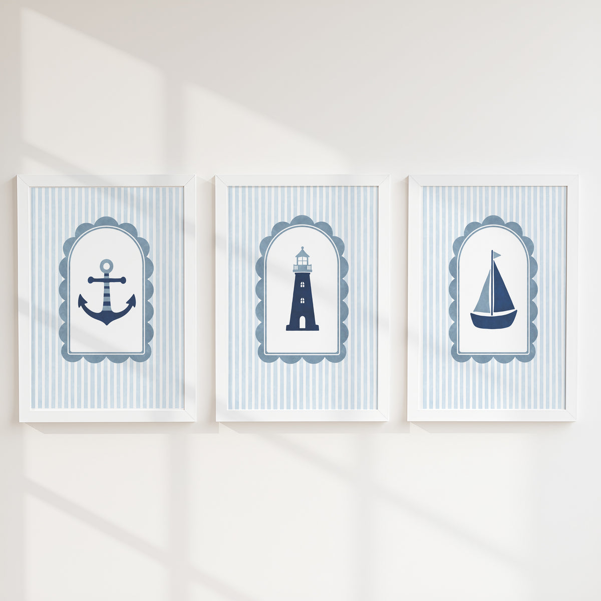 Anchor, lighthouse and sailboat nursery prints with blue stripes in white frames