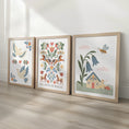 Load image into Gallery viewer, Folk art nursery print set featuring doves, Believe in Magic horses and a fairy cottage
