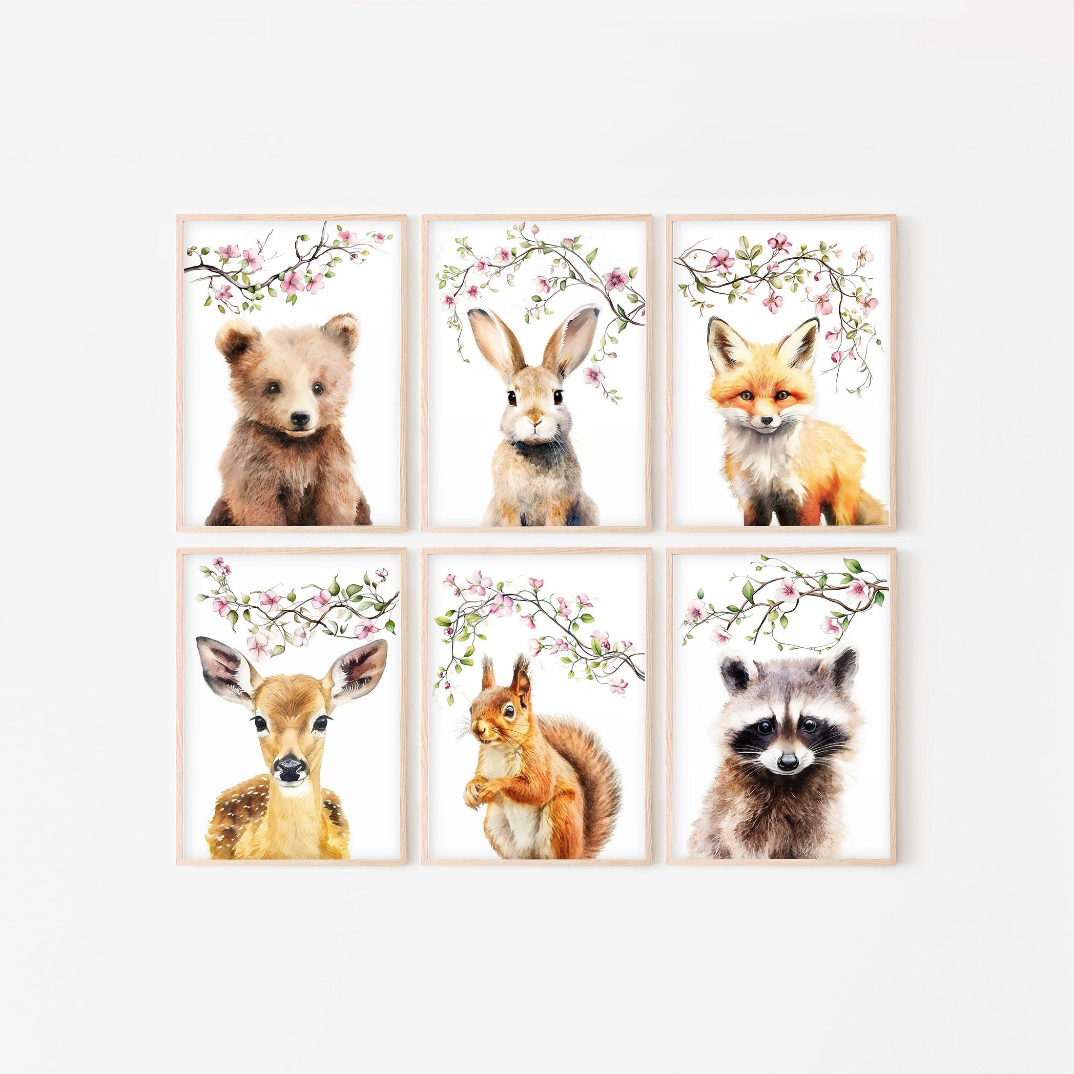 set of 6 woodland animal prints with pink blossom background, including a bear, fox, rabbit, deer, squirrel and racoon