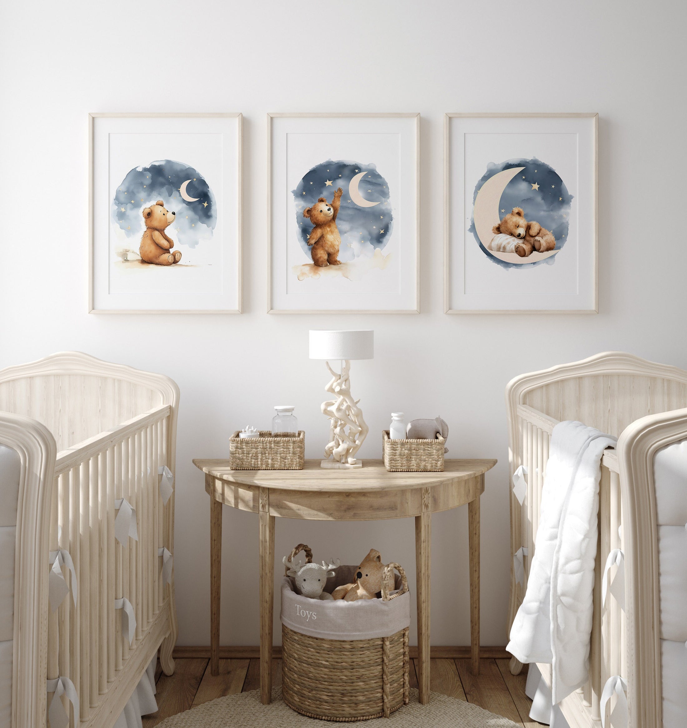 a baby&#39;s room with two cribs and a table