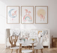 Load image into Gallery viewer, a baby's room with a crib, rocking chair, table, and
