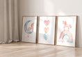 Load image into Gallery viewer, three framed pictures of unicorns and hearts on a wall
