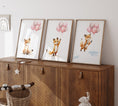 Load image into Gallery viewer, three framed pictures of foxes on a wooden cabinet
