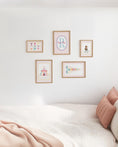 Load image into Gallery viewer, Personalised Circus Nursery Wall Art Set of 5 Prints | Girls Pink Vintage Circus Gallery Wall Posters in Optional White or Oak Frames

