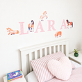 Load image into Gallery viewer, Close view of personalised name fabric wall stickers featuring pink patterned letters and watercolour horses
