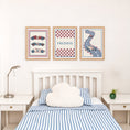 Load image into Gallery viewer, Set of three prints showing racing cars, checkerboard name print and winding race track, bedroom display
