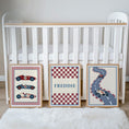 Load image into Gallery viewer, Set of three prints showing racing cars, checkerboard name print and winding race track, beside cot display
