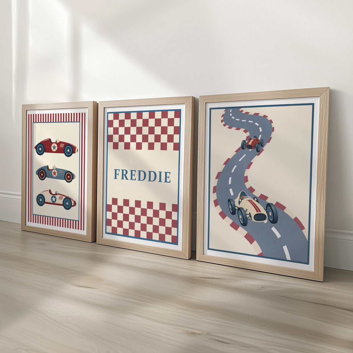 Set of three prints showing racing cars, checkerboard name print and winding race track, oak frames display