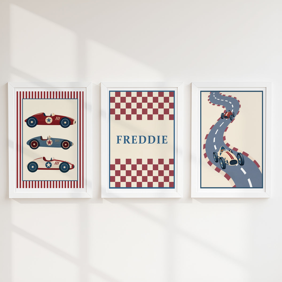 Set of three prints showing racing cars, checkerboard name print and winding race track, white frames display