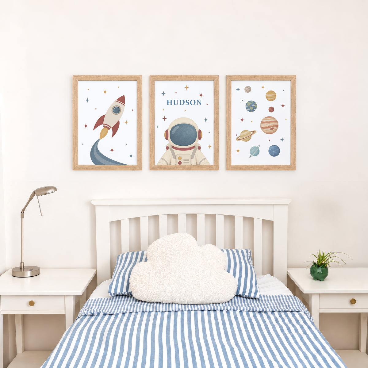 Set of three retro space prints showing rocket, personalised astronaut and planets, bedroom display