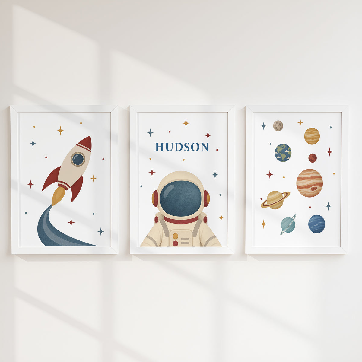 Personalised retro space prints with rocket, astronaut and planets in white frames