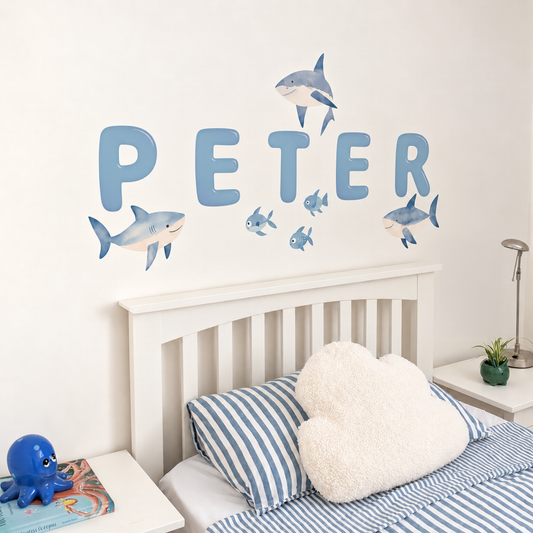 Close view of personalised name fabric wall stickers featuring blue bubble-effect letters with sharks and fish