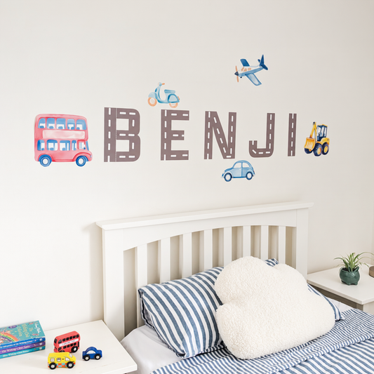 Close view of personalised name fabric wall stickers featuring road-pattern letters with a selection of vehicles