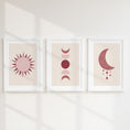 Load image into Gallery viewer, Set of three prints showing rose red sun, moon phases and crescent moon with stars, white frames display
