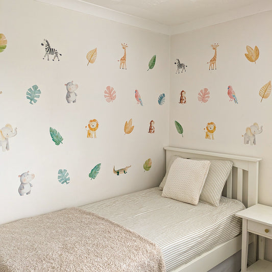 watercolour safari animal decals above a single bed